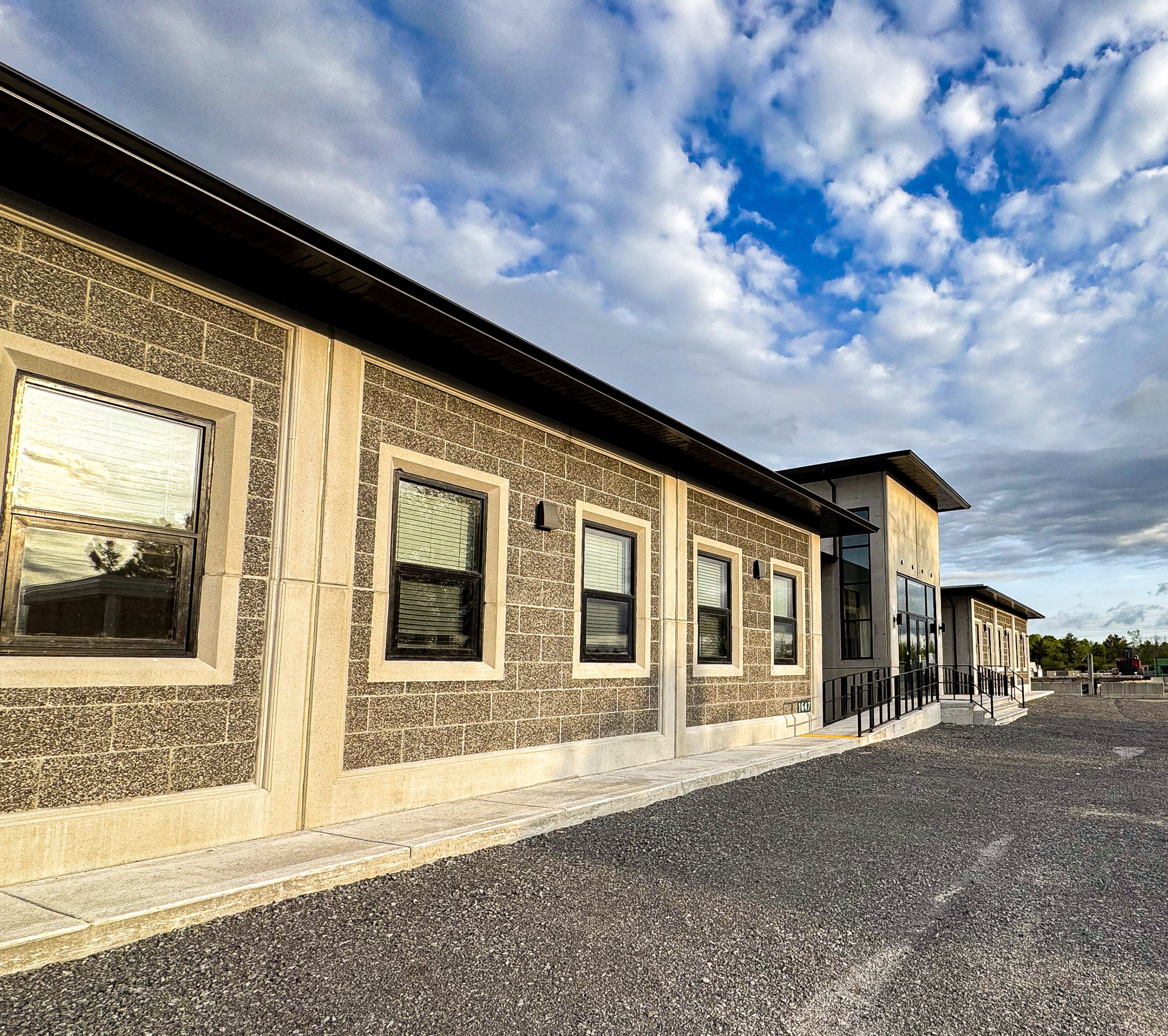 Completed Lodestar office from an oblique angle with project-specific glazing, masonry and concrete expression